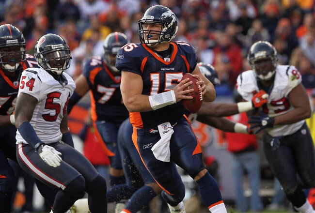 DENVER - DECEMBER 26:  Quarterback Tim Tebow #15 of the Denver Broncos rolls out and looks to deliver a pass against the Houston Texas at INVESCO Field at Mile High on December 26, 2010 in Denver, Colorado. The Broncos defeated the Texans 24-23.  (Photo by Doug Pensinger/Getty Images)