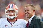 AUBURN, AL - SEPTEMBER 18:  Quarterback Kyle Parker #11 of the Clemson Tigers and ESPN commentator Kirk Herbstreit against the Auburn Tigers at Jordan-Hare Stadium on September 18, 2010 in Auburn, Alabama.  (Photo by Kevin C. Cox/Getty Images)