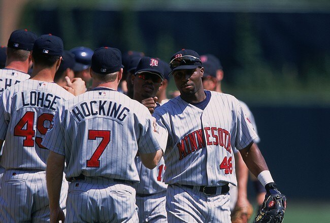 25 Jun 2001:  Torii Hunter #48 of the Minnesota Twins is greeted by teammate Denny Hocking #7 during the team line-ups before the game against the Detroit Tigers at the Comerica Park in Detroit, Michigan.  The Twins defeated the Tigers 6-3.Mandatory Credit: Tom Pigeon  /Allsport