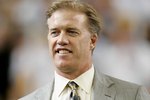 DETROIT - FEBRUARY 05:  Former Denver Broncos quarterback and MVP of Super Bowl XXIII, John Elway is seen on the field as he is introduced prior to Super Bowl XL between the Seattle Seahawks and the Pittsburgh Steelers at Ford Field on February 5, 2006 in Detroit, Michigan.  (Photo by Brian Bahr/Getty Images)