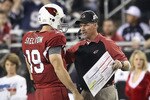 GLENDALE, AZ - DECEMBER 25:  Head coach Ken Whisenhunt of the Arizona Cardinals talks with quarterback John Skelton #19 during the NFL game against the Dallas Cowboys at the University of Phoenix Stadium on December 25, 2010 in Glendale, Arizona. The Cardinals defeated the Cowboys 27-26.  (Photo by Christian Petersen/Getty Images)