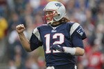 FOXBORO, MA - JANUARY 02:  Tom Brady #12 of the New England Patriots celebrates a touchdown by teammate BenJarvis Green-Ellis in the first quarter against the Miami Dolphins on January 2, 2011 at Gillette Stadium in Foxboro, Massachusetts.  (Photo by Elsa/Getty Images)