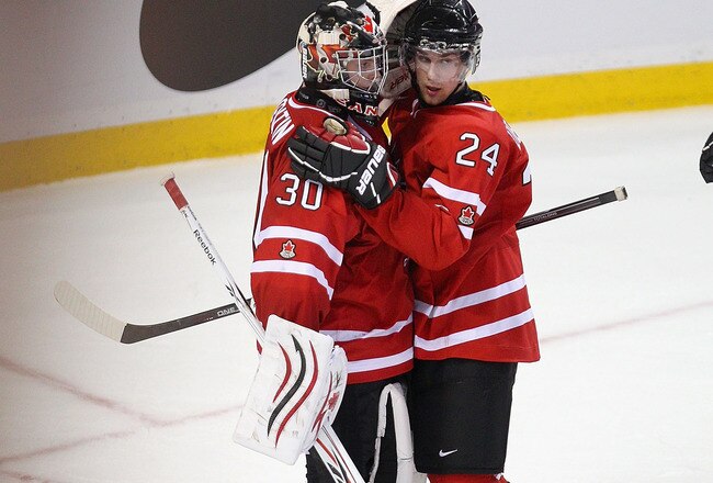 BUFFALO, NY - JANUARY 03:  Mark Visentin #30 and Calvin de Haan #24 of Canada celebrate defeating the United States 4-1  during the 2011 IIHF World U20 Championship Semi Final game between United States and Canada on January 3, 2011 in Buffalo, New York. Canada plays Russia in the final. (Photo by Rick Stewart/Getty Images)