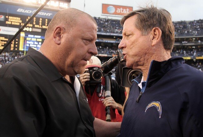 SAN DIEGO, CA - DECEMBER 5: Head Coach Tom Cable of the Oakland Raiders shakes the hand of Head Coach Norv Turner of the San Diego Chargers after the Raiders 24-13 victory during their NFL game at Qualcomm Stadium on December 5, 2010 in San Diego, California. (Photo by Donald Miralle/Getty Images)