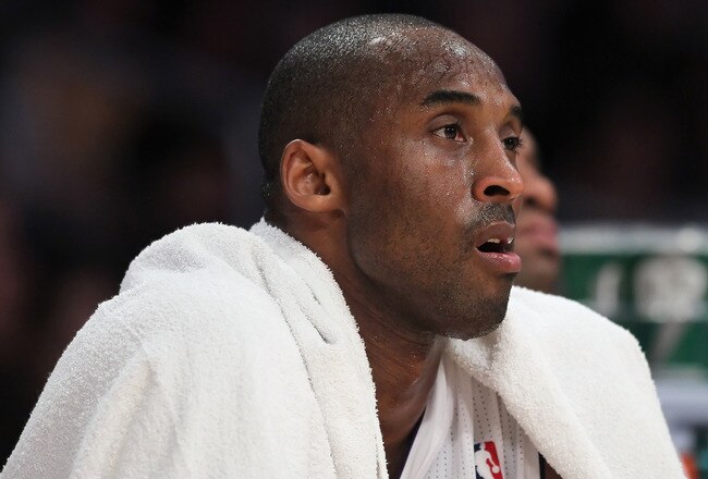LOS ANGELES, CA - JANUARY 02:  Kobe Bryant #24 of the Los Angeles Lakers looks on from the bench in the closing minutes of the game against the Memphis Grizzlies at Staples Center on January 2, 2011 in Los Angeles, California. The Grizzlies defeated the Lakers 104-85. NOTE TO USER: User expressly acknowledges and agrees that, by downloading and or using this photograph, User is consenting to the terms and conditions of the Getty Images License Agreement.  (Photo by Jeff Gross/Getty Images)