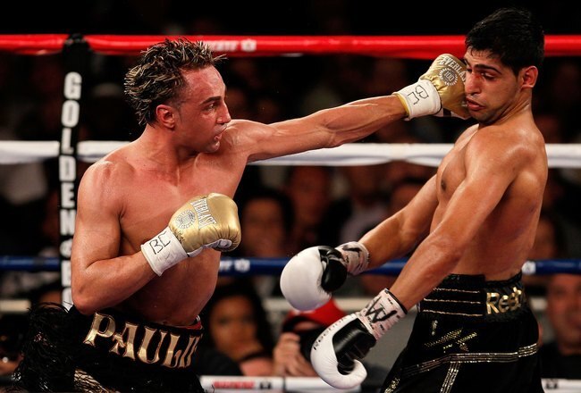 NEW YORK - MAY 15:   Paulie Malignaggi (L) hits Amir Khan of Great Britain during the WBA light welterweight title fight at Madison Square Garden on May 15, 2010 in New York City.  (Photo by Chris Trotman/Getty Images)