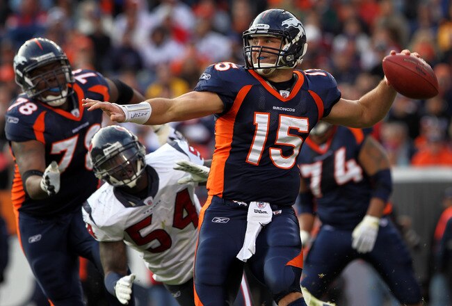 DENVER - DECEMBER 26:  Quarterback Tim Tebow #15 of the Denver Broncos rolls out and looks to deliver a pass against the Houston Texas at INVESCO Field at Mile High on December 26, 2010 in Denver, Colorado. The Broncos defeated the Texans 24-23.  (Photo by Doug Pensinger/Getty Images)