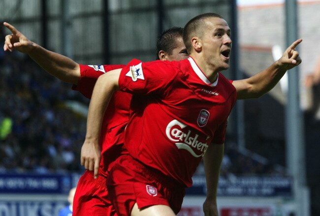 EVERTON, ENGLAND - AUGUST 30:  Michael Owen of Liverpool celebrates after scoring the second goal during the FA Barclaycard Premiership match between Everton and Liverpool at Goodison Park on August 30, 2003 in Liverpool, England. (Photo by Clive Brunskill/Getty Images)
