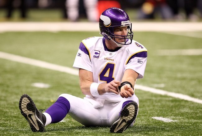 NEW ORLEANS - JANUARY 24:  Brett Favre #4 of the Minnesota Vikings sits on the turf after getting knocked down on a play against the New Orleans Saints during the NFC Championship Game at the Louisana Superdome on January 24, 2010 in New Orleans, Louisiana.  (Photo by Ronald Martinez/Getty Images)