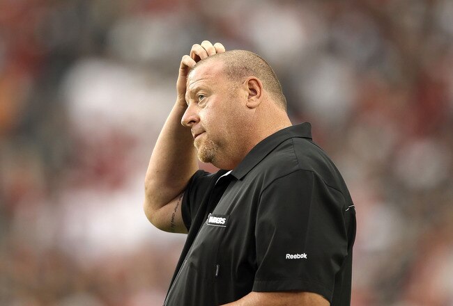 GLENDALE, AZ - SEPTEMBER 26:  Head coach Tom Cable of the Oakland Raiders stands on the sidelines during the NFL game against the Arizona Cardinals at the University of Phoenix Stadium on September 26, 2010 in Glendale, Arizona.  The Cardinals defeated the Raiders 24-23.  (Photo by Christian Petersen/Getty Images)