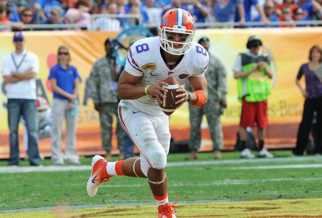 TAMPA, FL - JANUARY 1:  Quarterback Trey Burton #8  of the Florida Gators rushes upfield against the Penn State Nittany Lions January 1, 2010 in the 25th Outback Bowl at Raymond James Stadium in Tampa, Florida.  (Photo by Al Messerschmidt/Getty Images)