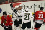 CHICAGO, IL - JANUARY 05: (L-R) Brenden Morrow #10, Brad Richards #91 and Loui Eriksson #21 of the Dallas Stars celebrate Morrows' 1st period goal as Duncan Kieth #2 and Jonathan Toews #19 of the Chicago Blackhawks skate away at the United Center on January 5, 2011 in Chicago, Illinois. (Photo by Jonathan Daniel/Getty Images)