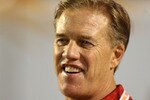 MIAMI, FL - JANUARY 03:  Stanford alum John Elway stands on the Stanford Cardinal sideline against the Virginai Tech Hokies during the 2011 Discover Orange Bowl at Sun Life Stadium on January 3, 2011 in Miami, Florida.  (Photo by Marc Serota/Getty Images)