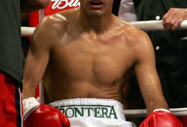 LAS VEGAS - JANUARY 21:  Erik Morales of Mexico sits in his corner before the 10th round of his fight against Manny Pacquiao of the Phillippines during their Super Featherweight Championship fight at Thomas & Mack Arena on January 21, 2006 in Las Vegas, Nevada. Pacquiao knocked out Morales in the 10th round for the victory.  (Photo by Jed Jacobsohn/Getty Images)