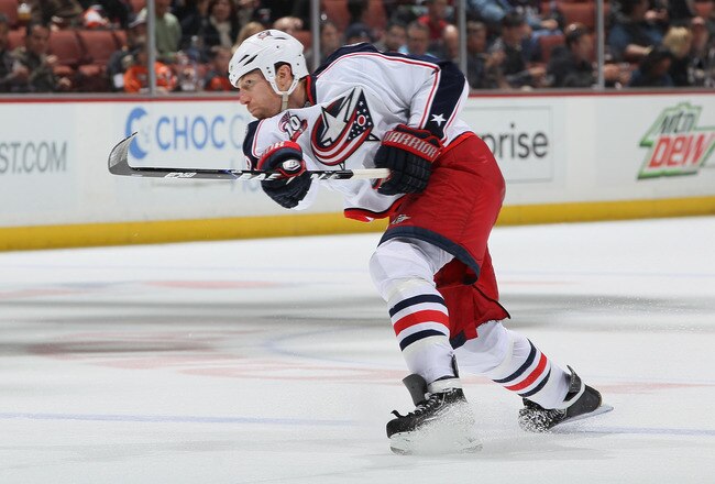 ANAHEIM, CA - NOVEMBER 19:  Mike Commodore #22 of the Columbus Blue Jackets shoots the puck against the Anaheim Ducks at the Honda Center on November 19, 2010 in Anaheim, California.  (Photo by Jeff Gross/Getty Images)