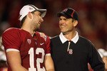 MIAMI, FL - JANUARY 03: (L-R) Quarterback Andrew Luck and head coach Jim Harbaugh of the Stanford Cardinal celebrate on stage after Stanford won 40-12 against the Virginia Tech Hokies during the 2011 Discover Orange Bowl at Sun Life Stadium on January 3, 2011 in Miami, Florida. (Photo by Marc Serota/Getty Images)