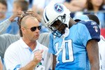 NASHVILLE, TN - NOVEMBER 21:  Quarterback Vince Young #11 of the Tennessee Titans talks with a member of the training staff after leaving a game against the Washington Redskins at LP Field on November 21, 2010 in Nashville, Tennessee. The Redskins won 19-16 in overtime.  (Photo by Grant Halverson/Getty Images)
