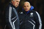 LONDON, ENGLAND - DECEMBER 20:  Carlo Ancelotti (L), Manager of Chelsea talks with assistant Ray Wilkins during the Barclays Premier League match between West Ham United and Chelsea at Upton Park on December 20, 2009 in London, England.  (Photo by Phil Cole/Getty Images)