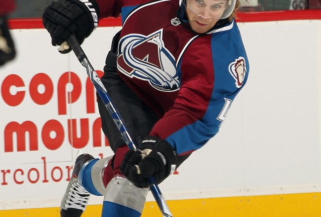 DENVER - DECEMBER 23:  John-Michael Liles #4 of the Colorado Avalanche takes a slap shot against the Minnesota Wild at the Pepsi Center on December 23, 2010 in Denver, Colorado. The Wild defeated the Avalanche 3-1.  (Photo by Doug Pensinger/Getty Images)