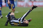 TURIN, ITALY - JANUARY 06:  Fabio Quagliarella of Juventus FC lies injured during the Serie A match between Juventus FC and Parma FC at Olimpico Stadium on January 6, 2011 in Turin, Italy.  (Photo by Valerio Pennicino/Getty Images)