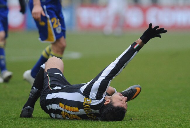 TURIN, ITALY - JANUARY 06:  Fabio Quagliarella of Juventus FC lies injured during the Serie A match between Juventus FC and Parma FC at Olimpico Stadium on January 6, 2011 in Turin, Italy.  (Photo by Valerio Pennicino/Getty Images)