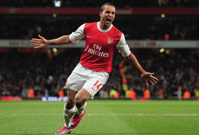 LONDON, ENGLAND - DECEMBER 27:  Theo Walcott of Arsenal celebrates Arsenal's third goal during the Barclays Premier League match between Arsenal and Chelsea at the Emirates Stadium on December 27, 2010 in London, England.  (Photo by Shaun Botterill/Getty Images)