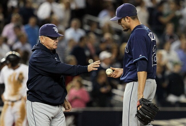 NEW YORK - SEPTEMBER 20:  Matt Garza #22 of the Tampa Bay Rays hands the ball to manager Joe Maddon as he leaves the game in the sixth inning against the New York Yankees on September 20, 2010 at Yankee Stadium in the Bronx borough of New York City.  (Photo by Jim McIsaac/Getty Images)