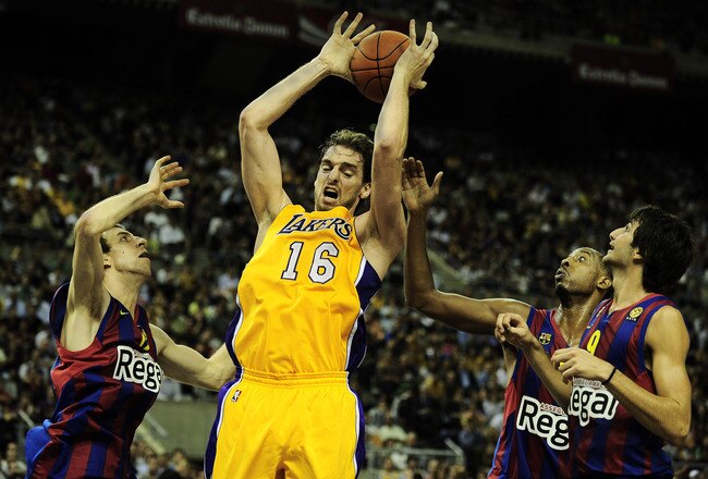 BARCELONA, SPAIN - OCTOBER 07:  Pau Gasol #16 of the Los Angeles Lakers (2nd-L) fights for a rebound against Fran Vazquez #17 of the Regal FC Barcelona (L), Terence Morris #23 of the Regal FC Barcelona (2nd-R) and Ricky Rubio #9 of the Regal FC Barcelona during the NBA Europe Live match between Los Angeles Lakers and Regal FC Barcelona at the at Palau Blaugrana on October 7, 2010 in Barcelona, Spain.  (Photo by David Ramos/Getty Images)