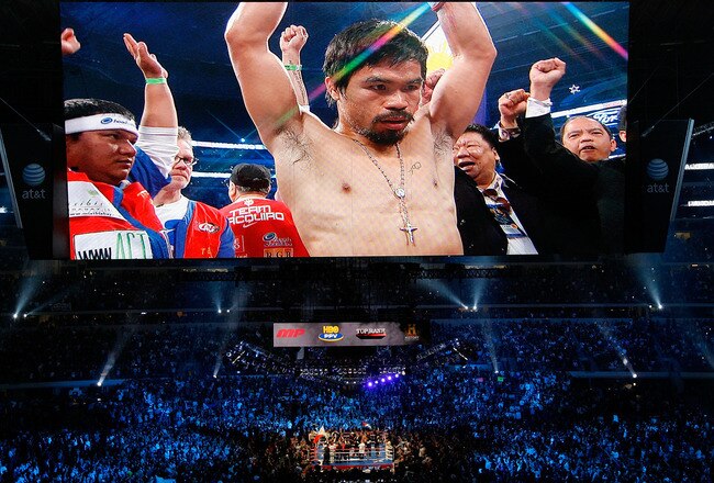 ARLINGTON, TX - NOVEMBER 13:  The likeness Manny Pacquiao (white trunks) of the Philippines is seen on the giant screen as he is introduced prior to fighting against Antonio Margarito (black trunks) of Mexico during their WBC World Super Welterweight Title bout at Cowboys Stadium on November 13, 2010 in Arlington, Texas.  (Photo by Tom Pennington/Getty Images)