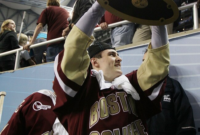 DETROIT - APRIL 10:  Chris Kreider #19 of the Boston College Eagles carries the trophy off the ice after the championship game of the 2010 NCAA Frozen Four on April 10, 2010 at Ford Field in Detroit, Michigan. Boston College defeated Wisconsin 5-0 to win the national title.  (Photo by Elsa/Getty Images)