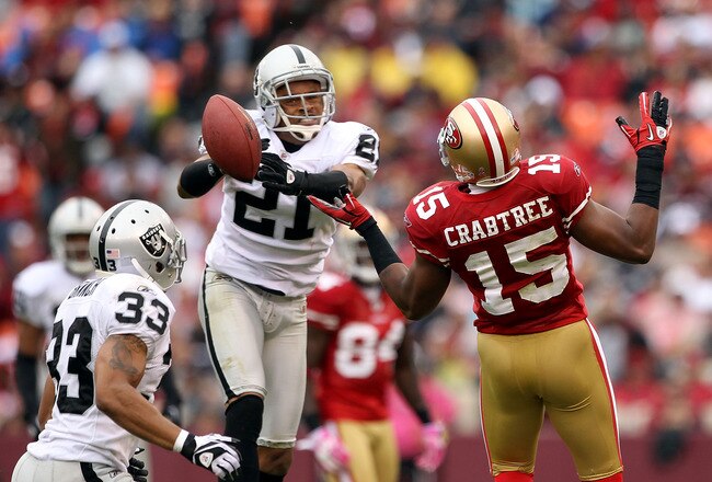 SAN FRANCISCO - OCTOBER 17:  Nnamdi Asomugha  #21 of the Oakland Raiders breaks up a pass intended for Michael Crabtree #15 of the San Francisco 49ers at Candlestick Park on October 17, 2010 in San Francisco, California.  (Photo by Ezra Shaw/Getty Images)