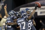 SEATTLE, WA - JANUARY 08:  Running back Marshawn Lynch #24 of the Seattle Seahawks celebrates with his teammates his 67-yard touchdown run in the fourth quarter against the New Orleans Saints during the 2011 NFC wild-card playoff game at Qwest Field on January 8, 2011 in Seattle, Washington.  (Photo by Jonathan Ferrey/Getty Images)