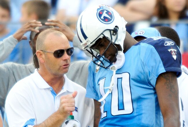 NASHVILLE, TN - NOVEMBER 21:  Quarterback Vince Young #11 of the Tennessee Titans talks with a member of the training staff after leaving a game against the Washington Redskins at LP Field on November 21, 2010 in Nashville, Tennessee. The Redskins won 19-16 in overtime.  (Photo by Grant Halverson/Getty Images)
