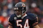 CHICAGO, IL - DECEMBER 26: Brian Urlacher #54 of the Chicago Bears awaits the start of play as Mark Sanchez #6 of the New York Jets calls offensive signals at Soldier Field on December 26, 2010 in Chicago, Illinois. The Bears defeated the Jets 38-34. (Photo by Jonathan Daniel/Getty Images)