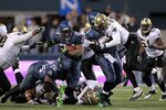 SEATTLE, WA - JANUARY 08:  Running back Marshawn Lynch #24 of the Seattle Seahawks runs for a 67-yard touchdown run in the fourth quarter against the New Orleans Saints during the 2011 NFC wild-card playoff game at Qwest Field on January 8, 2011 in Seattle, Washington.  (Photo by Otto Greule Jr/Getty Images)