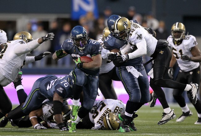 SEATTLE, WA - JANUARY 08:  Running back Marshawn Lynch #24 of the Seattle Seahawks runs for a 67-yard touchdown run in the fourth quarter against the New Orleans Saints during the 2011 NFC wild-card playoff game at Qwest Field on January 8, 2011 in Seattle, Washington.  (Photo by Otto Greule Jr/Getty Images)