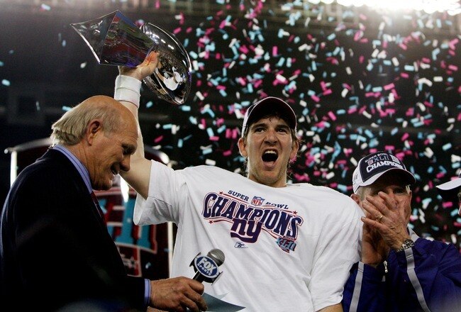 GLENDALE, AZ - FEBRUARY 03:  Quarterback Eli Manning #10 of the New York Giants holds the Vince Lombardi Trophy after defeating the New England Patriots 17 - 14 in Super Bowl XLII on February 3, 2008 at the University of Phoenix Stadium in Glendale, Arizona.  (Photo by Harry How/Getty Images)