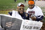GLENDALE, AZ - JANUARY 10:  Auburn Tigers tigers players read the Arizona Republic after the Tigers defeated the Oregon Ducks 22-19 during the Tostitos BCS National Championship Game at University of Phoenix Stadium on January 10, 2011 in Glendale, Arizona.  (Photo by Christian Petersen/Getty Images)