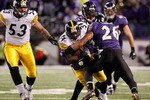 BALTIMORE, MD - DECEMBER 05:  Rashard Mendenhall #34  of the Pittsburgh Steelers runs the ball as he is tackled by Dawan Landry #26 of the Baltimore Ravens during the third quarter of the game at M&T Bank Stadium on December 5, 2010 in Baltimore, Maryland. Pittsburgh won 13-10. (Photo by Geoff Burke/Getty Images)