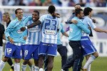 MALAGA, SPAIN - MAY 16:  Players of Malaga celebrate after the La Liga match between Malaga and Real Madrid at La Rosaleda Stadium on May 16, 2010 in Malaga, Spain.  (Photo by Angel Martinez/Getty Images)