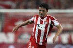 MUNICH, GERMANY - AUGUST 20: Mark van Bommel of Bayern is challenged by Cicero of Wolfsburg during the Bundesliga match between FC Bayern Muenchen and VfL Wolfsburg at Allianz Arena on August 20, 2010 in Munich, Germany.  (Photo by Clive Brunskill/Getty Images)