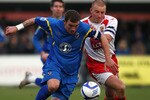LONDON, ENGLAND - NOVEMBER 27:  Danny Kedwell of Wimbledon and Mark Roberts of Stevenage battle for the ball during the FA Cup 2nd Round match between AFC Wimbledon and Stevenage Borough at Kingsmeadow Stadium on November 27, 2010 in Wimbledon, England.  (Photo by Dean Mouhtaropoulos/Getty Images)