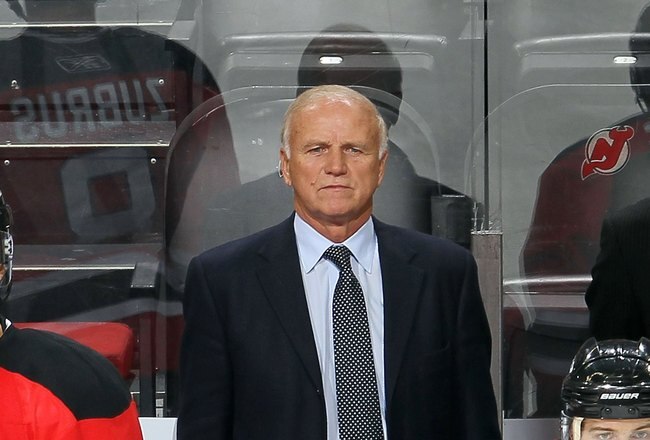 NEWARK, NJ - DECEMBER 23:  Head coach Jacques Lemaire of the New Jersey Devils looks on against the New York Islanders at the Prudential Center on December 23, 2010 in Newark, New Jersey.  (Photo by Jim McIsaac/Getty Images)