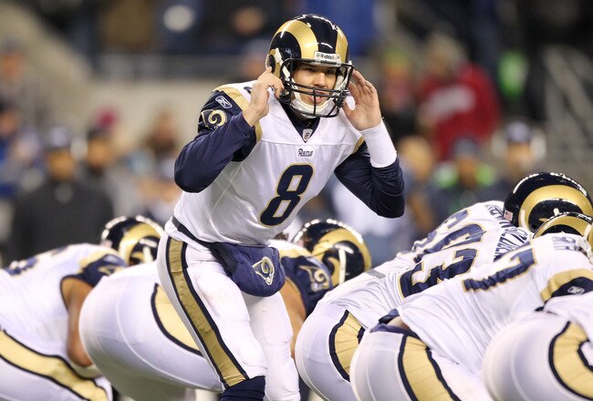 SEATTLE, WA - JANUARY 02:  Quarterback Sam Bradford #8 of the St. Louis Rams signals to his teammates during their game against the Seattle Seahawks at Qwest Field on January 2, 2011 in Seattle, Washington.  (Photo by Otto Greule Jr/Getty Images)
