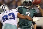 ARLINGTON, TX - DECEMBER 12:  Quarterback Michael Vick #7 of the Philadelphia Eagles drops back to pass against Anthony Spencer #93 of the Dallas Cowboys at Cowboys Stadium on December 12, 2010 in Arlington, Texas.  (Photo by Ronald Martinez/Getty Images)