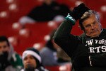 EAST RUTHERFORD, NJ - OCTOBER 18: A New York Jets fan stands dejected after the game following the game winning field goal by Rian Lindell #9 of the Buffalo Bills on October 18, 2009 at Giants Stadium in East Rutherford, New Jersey. (Photo by Jared Wickerham/Getty Images)