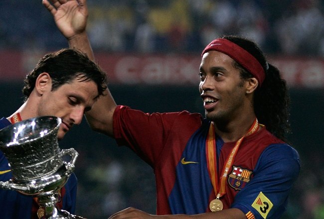 BARCELONA, SPAIN - AUGUST 20: Ronaldinho (R) of Barcelona celebrates with Juliano Belletti after winning the Supercup against Espanyol at the Camp Nou stadium on August 20, 2006 in Barcelona, Spain.  (Photo by Denis Doyle/Getty Images)