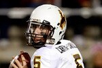 LAS VEGAS - NOVEMBER 13:  Quarterback Austyn Carta-Samuels #5 of the Wyoming Cowboys looks to pass during a game against the UNLV Rebels at Sam Boyd Stadium November 13, 2010 in Las Vegas, Nevada. UNLV won 42-16.  (Photo by Ethan Miller/Getty Images)