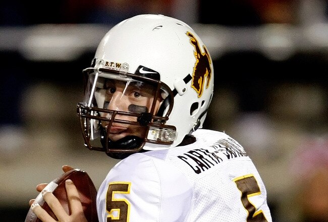 LAS VEGAS - NOVEMBER 13:  Quarterback Austyn Carta-Samuels #5 of the Wyoming Cowboys looks to pass during a game against the UNLV Rebels at Sam Boyd Stadium November 13, 2010 in Las Vegas, Nevada. UNLV won 42-16.  (Photo by Ethan Miller/Getty Images)