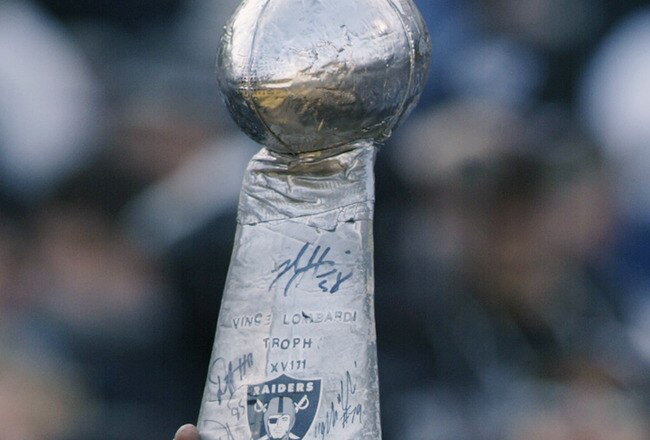 OAKLAND, CA - JANUARY 19:  A Raiders fan holds up a mock Vince Lombardi Trophy prior to the AFC Championship game between the Tennessee Titans and the Oakland Raiders at Network Associates Coliseum on January 19, 2003 in Oakland, California.  The Raiders defeated the Titans 41-24, sending them on to the NFL title game for the first time since 1984.  (Photo by Stephen Dunn/Getty Images)